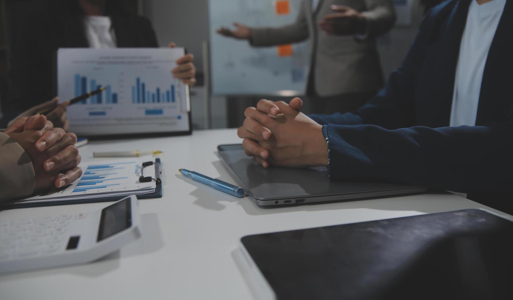 Business team collaboration discussing working analyzing with financial data and marketing growth report graph in team, presentation and brainstorming to strategy planning making profit of company. photo