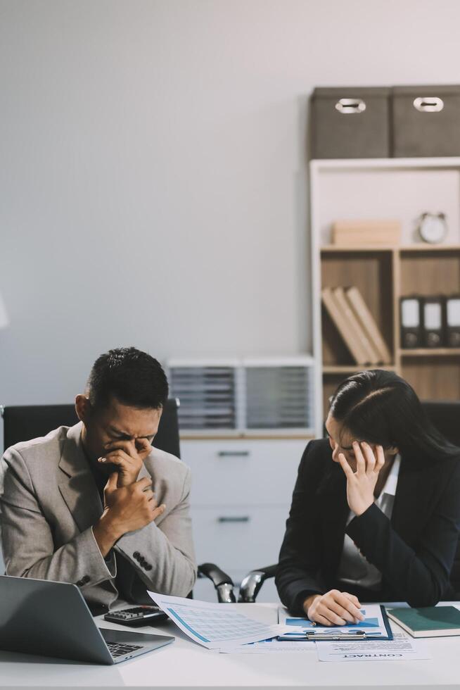 Manager is hard talking with employee in an office. Businessmen arguing at workplace, disagreeing over document, partners having conflict while negotiating, business deal failure photo
