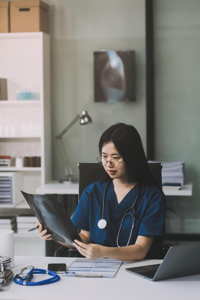 Medical working on digital tablet healthcare doctor technology tablet using x-ray film analyzed the results of medical reports. photo