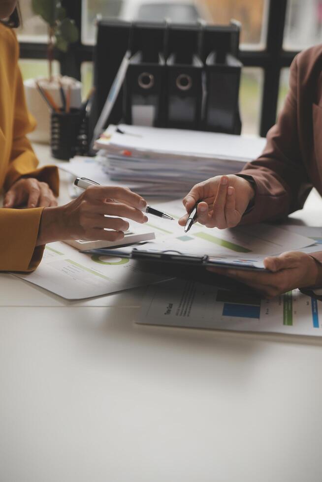 Team of business people working together in the meeting room office, teamwork background charts and graphs banner, double exposure successful teamwork,business planning concept. photo