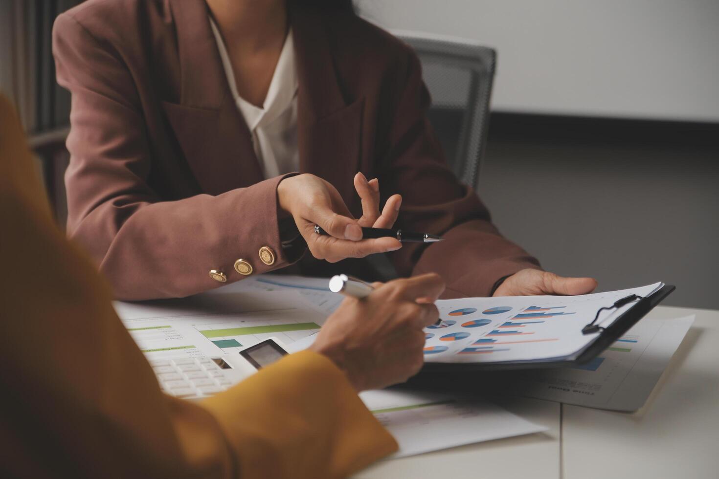 Team of business people working together in the meeting room office, teamwork background charts and graphs banner, double exposure successful teamwork,business planning concept. photo