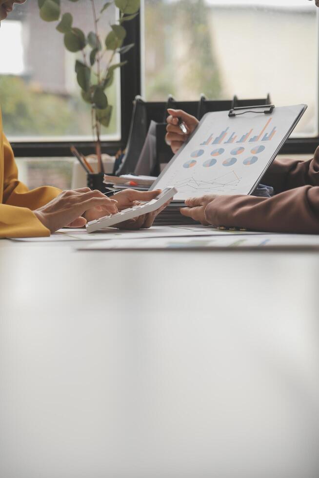 Team of business people working together in the meeting room office, teamwork background charts and graphs banner, double exposure successful teamwork,business planning concept. photo