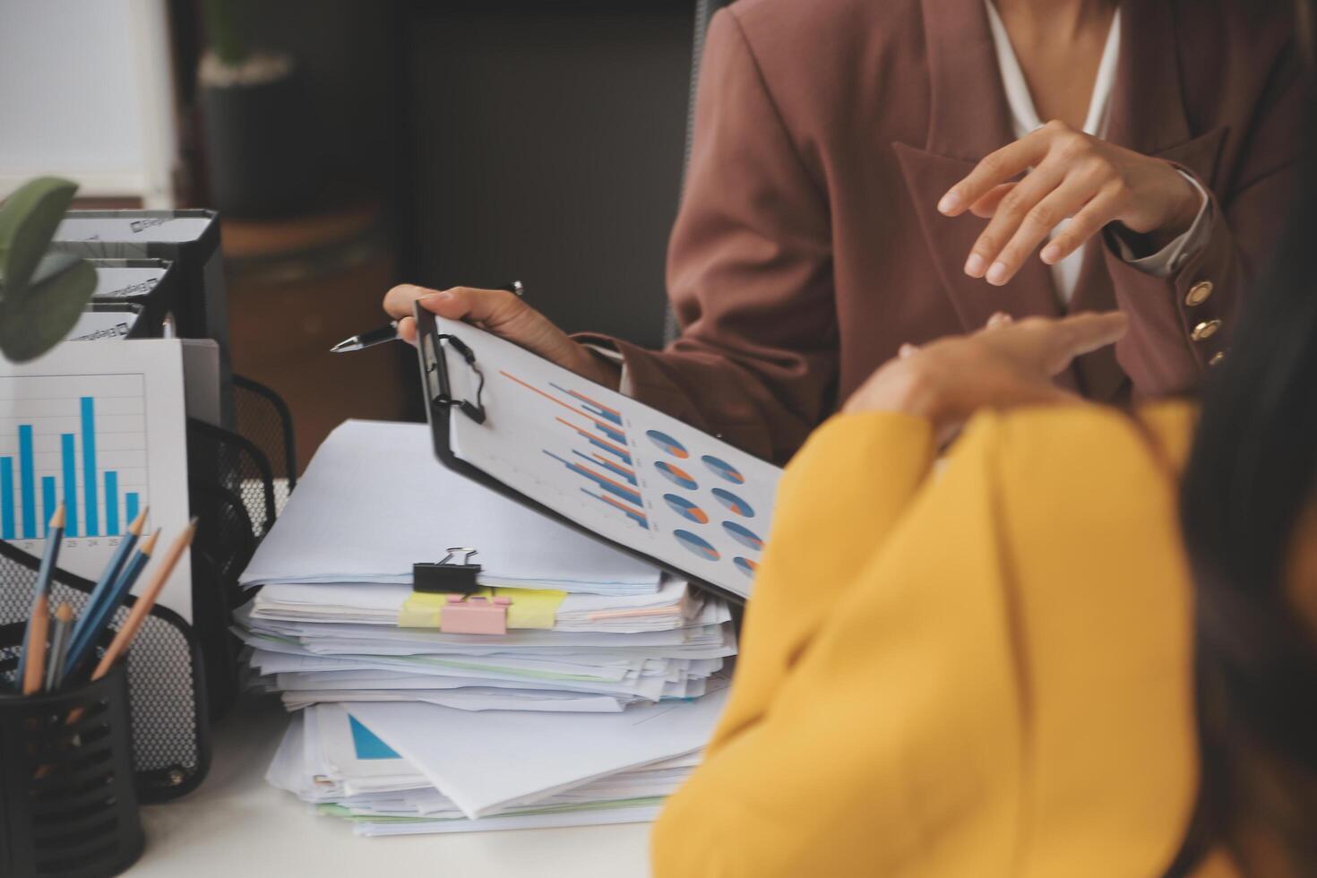 Team of business people working together in the meeting room office, teamwork background charts and graphs banner, double exposure successful teamwork,business planning concept. photo