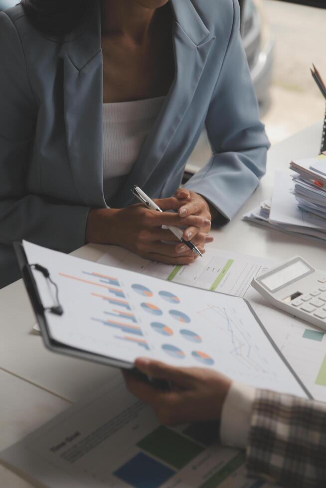 Team of business people working together in the meeting room office, teamwork background charts and graphs banner, double exposure successful teamwork,business planning concept. photo