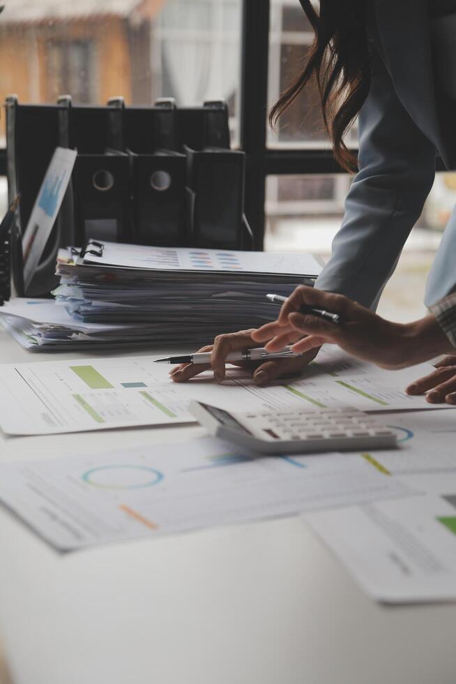 Team of business people working together in the meeting room office, teamwork background charts and graphs banner, double exposure successful teamwork,business planning concept. photo