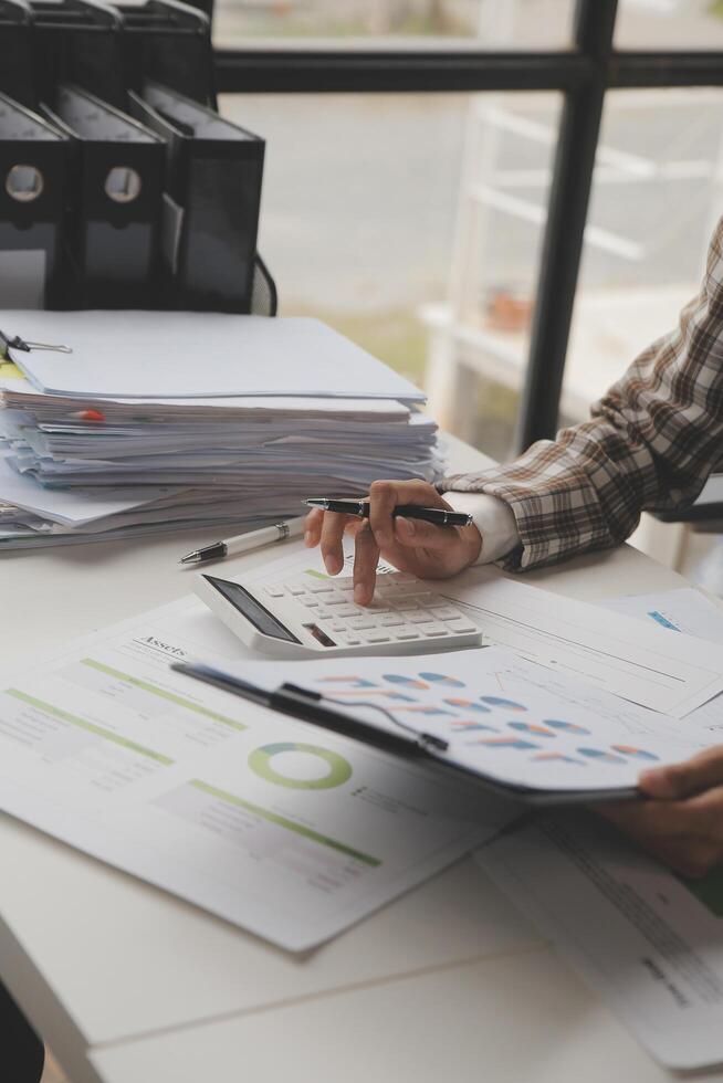 Team of business people working together in the meeting room office, teamwork background charts and graphs banner, double exposure successful teamwork,business planning concept. photo
