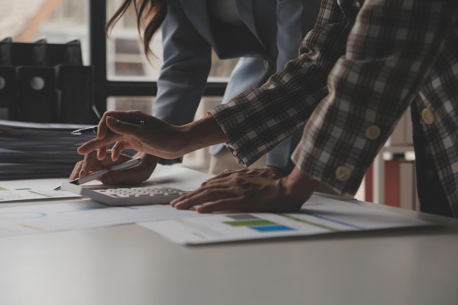 Team of business people working together in the meeting room office, teamwork background charts and graphs banner, double exposure successful teamwork,business planning concept. photo