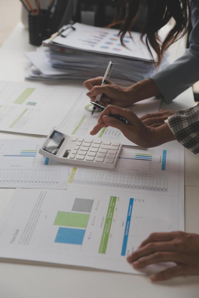 Team of business people working together in the meeting room office, teamwork background charts and graphs banner, double exposure successful teamwork,business planning concept. photo