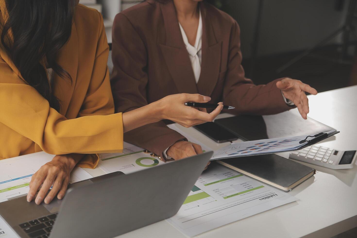 Team of business people working together in the meeting room office, teamwork background charts and graphs banner, double exposure successful teamwork,business planning concept. photo