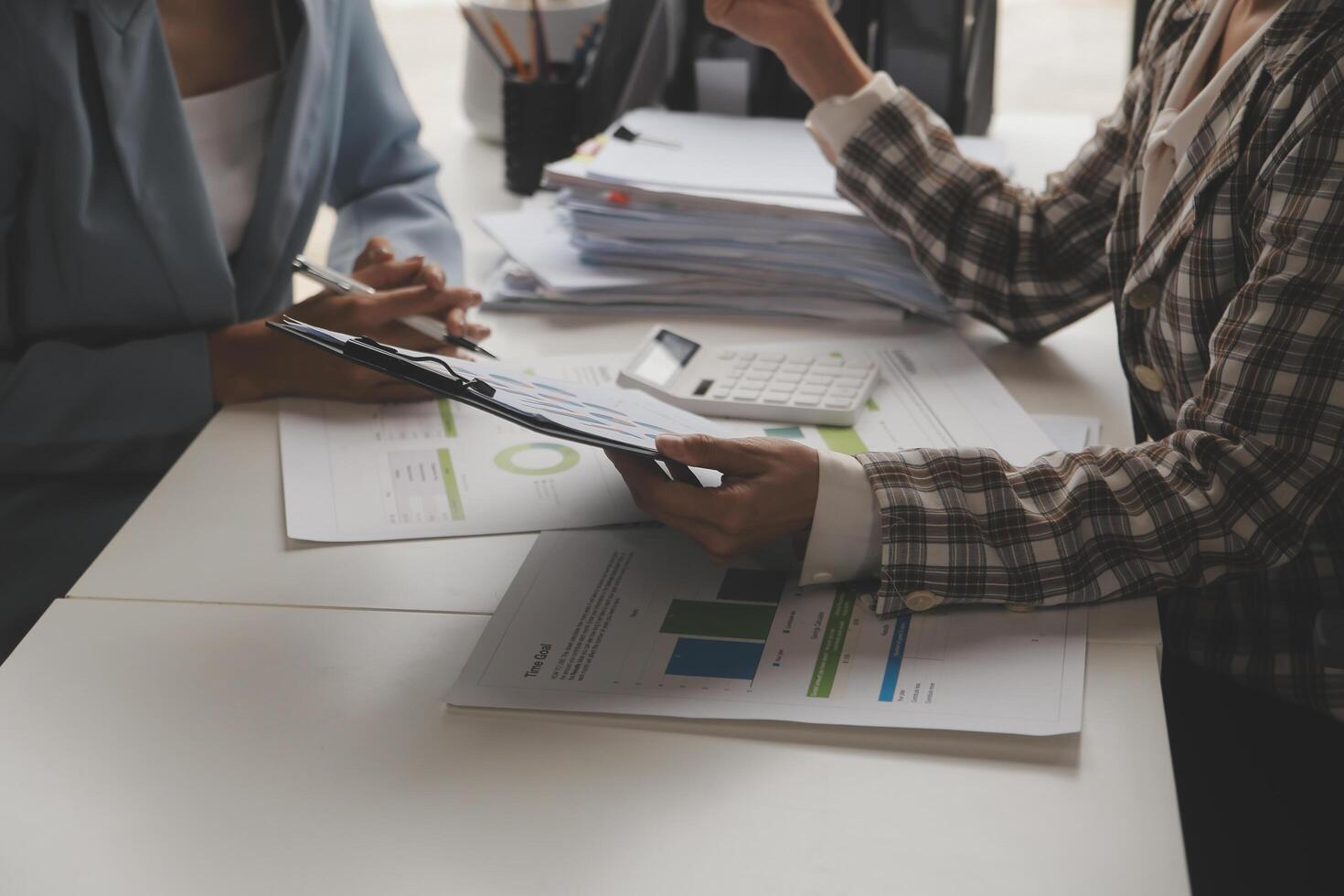 Team of business people working together in the meeting room office, teamwork background charts and graphs banner, double exposure successful teamwork,business planning concept. photo