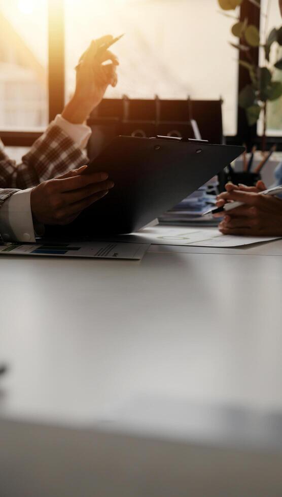 Team of business people working together in the meeting room office, teamwork background charts and graphs banner, double exposure successful teamwork,business planning concept. photo