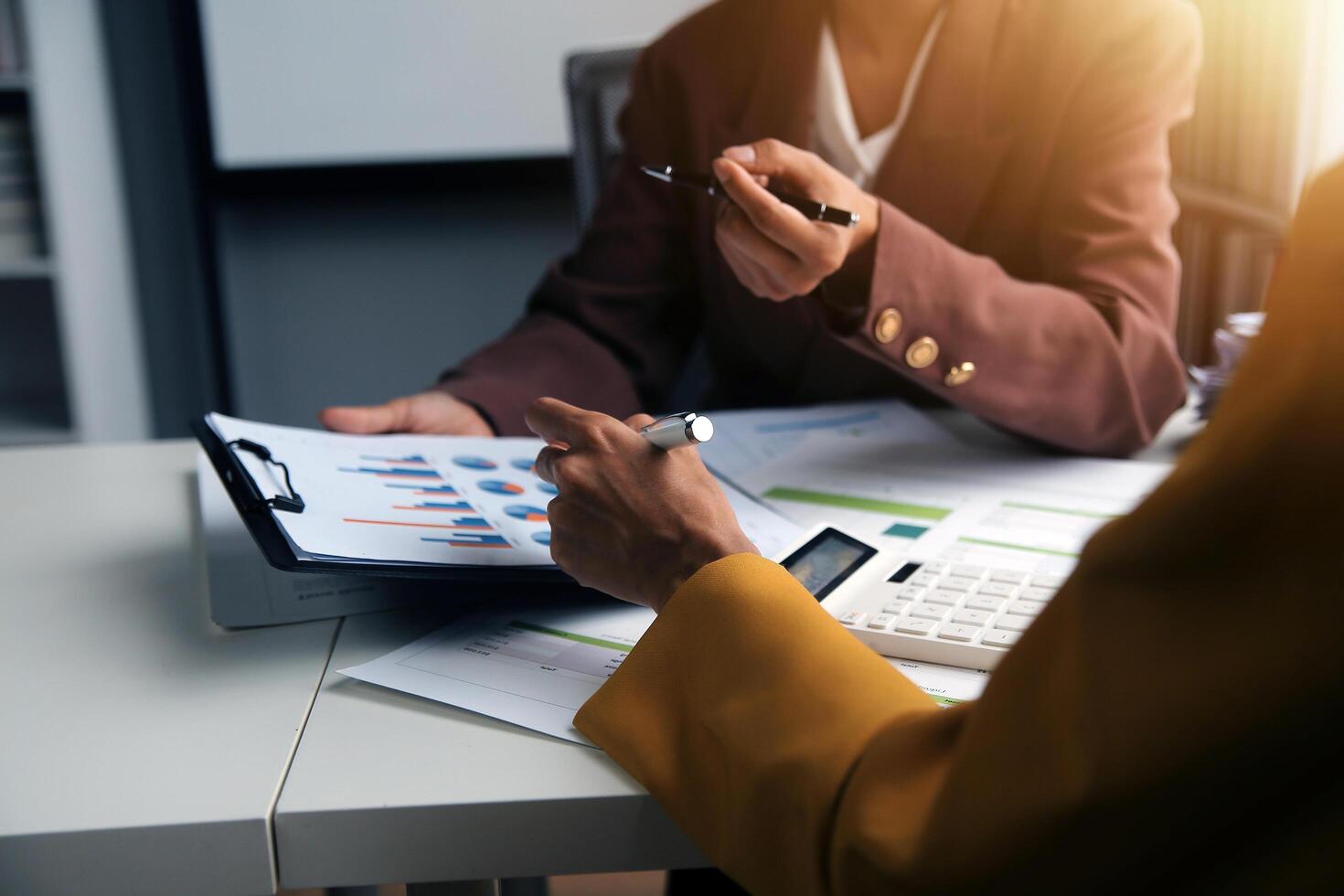 Team of business people working together in the meeting room office, teamwork background charts and graphs banner, double exposure successful teamwork,business planning concept. photo