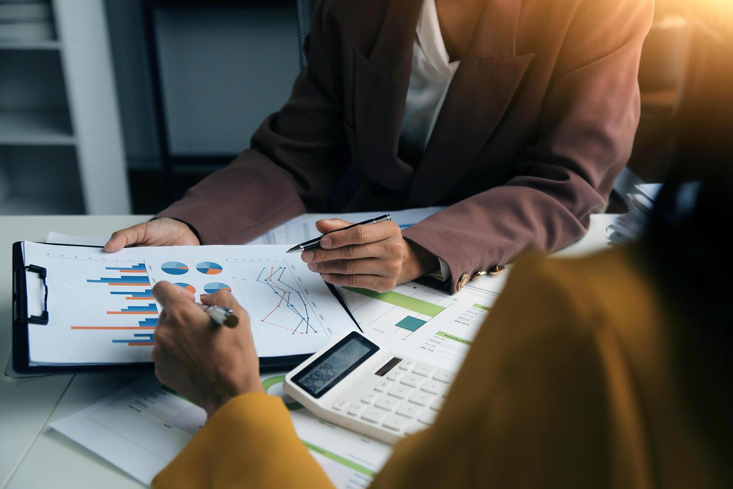 Team of business people working together in the meeting room office, teamwork background charts and graphs banner, double exposure successful teamwork,business planning concept. photo