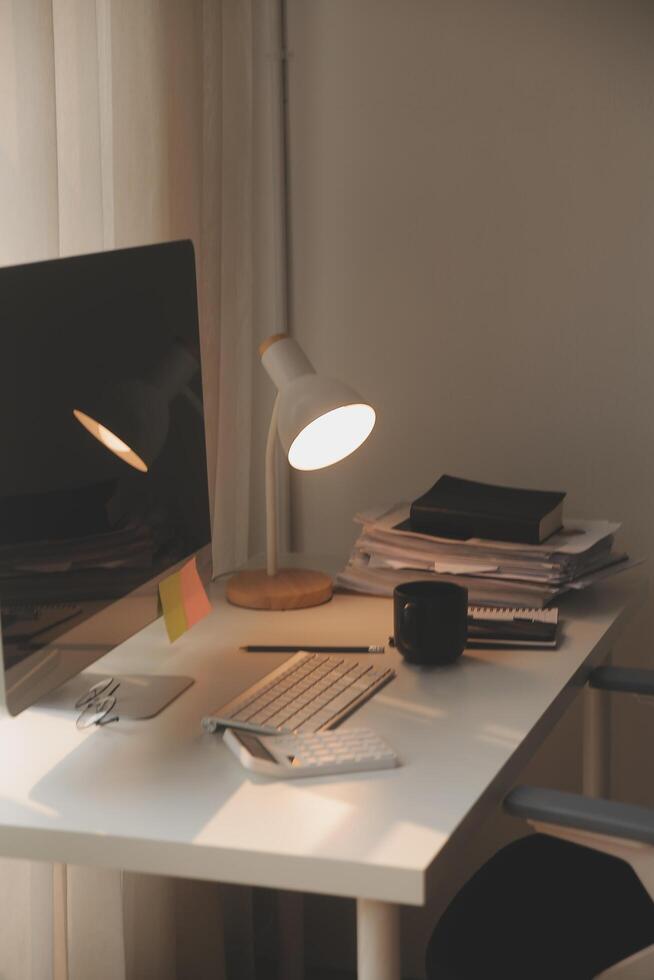 messy office workspace. Messy and cluttered office desk. Messy business office with piles of files and disorganized clutter. photo
