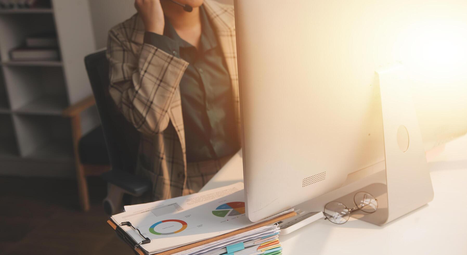 Call center, computer and business with woman in office for customer service, technical support and advice. Technology, contact us and communication with employee operator in help desk agency photo