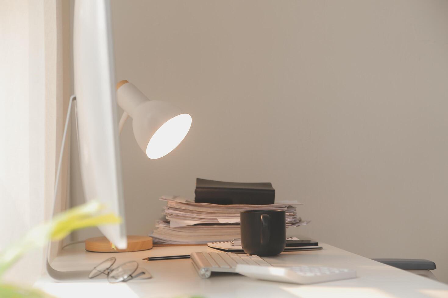 messy office workspace. Messy and cluttered office desk. Messy business office with piles of files and disorganized clutter. photo