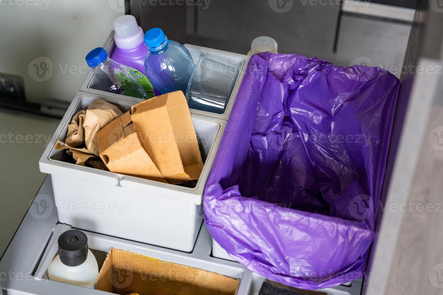 Household bins for waste sorting in the kitchen for recycle. Plastic, paper, bio and mixed waste. Sorting waste at home concept. High quality photo