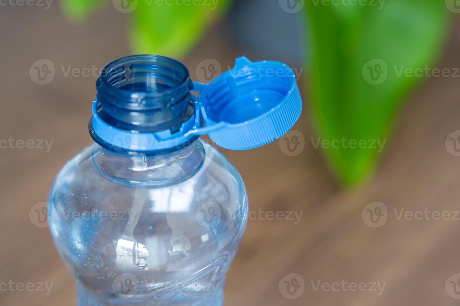 Stationary plastic cap on a PET bottle. The new design means the cap remains attached to the bottle after opening, making the entire package easier to collect and recycle. High quality photo
