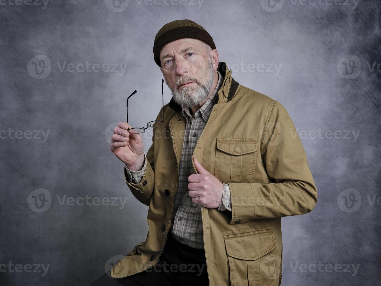bearded senior man with glasses photo