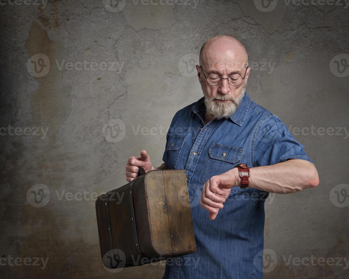 senior man is checking time photo