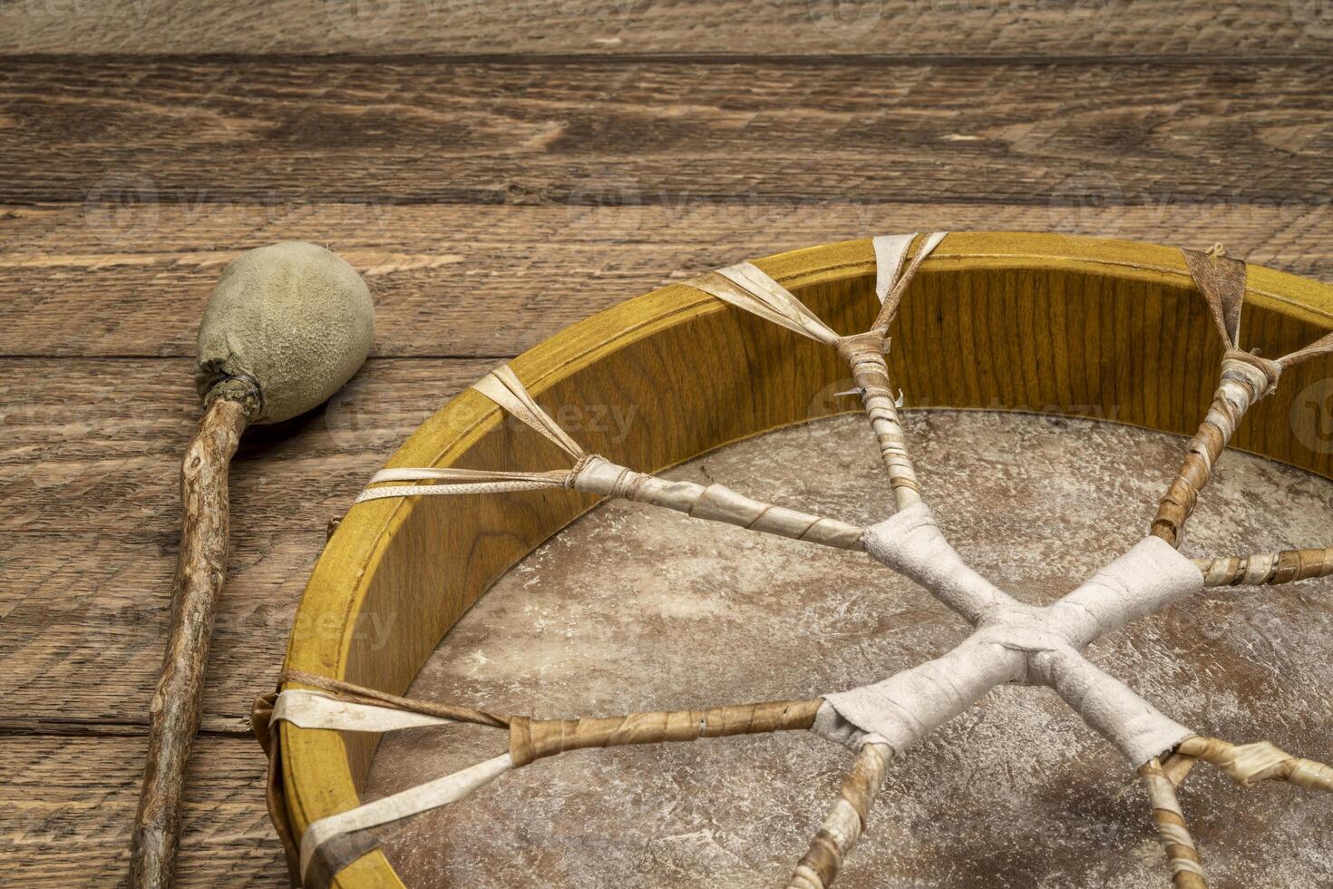 shaman frame drum with a beater photo