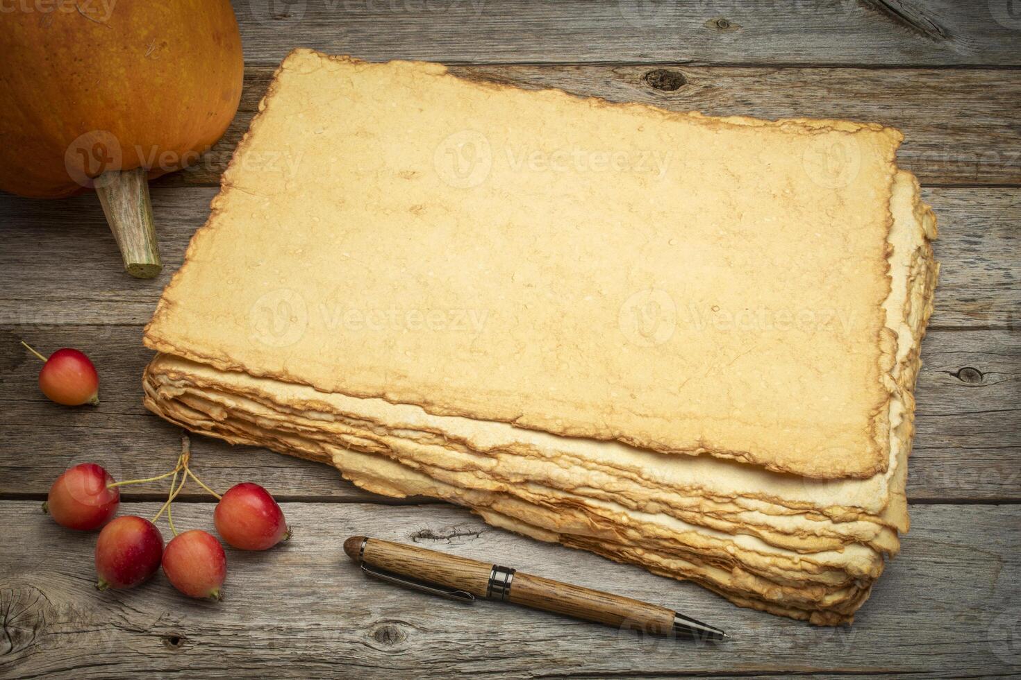stack of blank handmade paper with rough edges photo