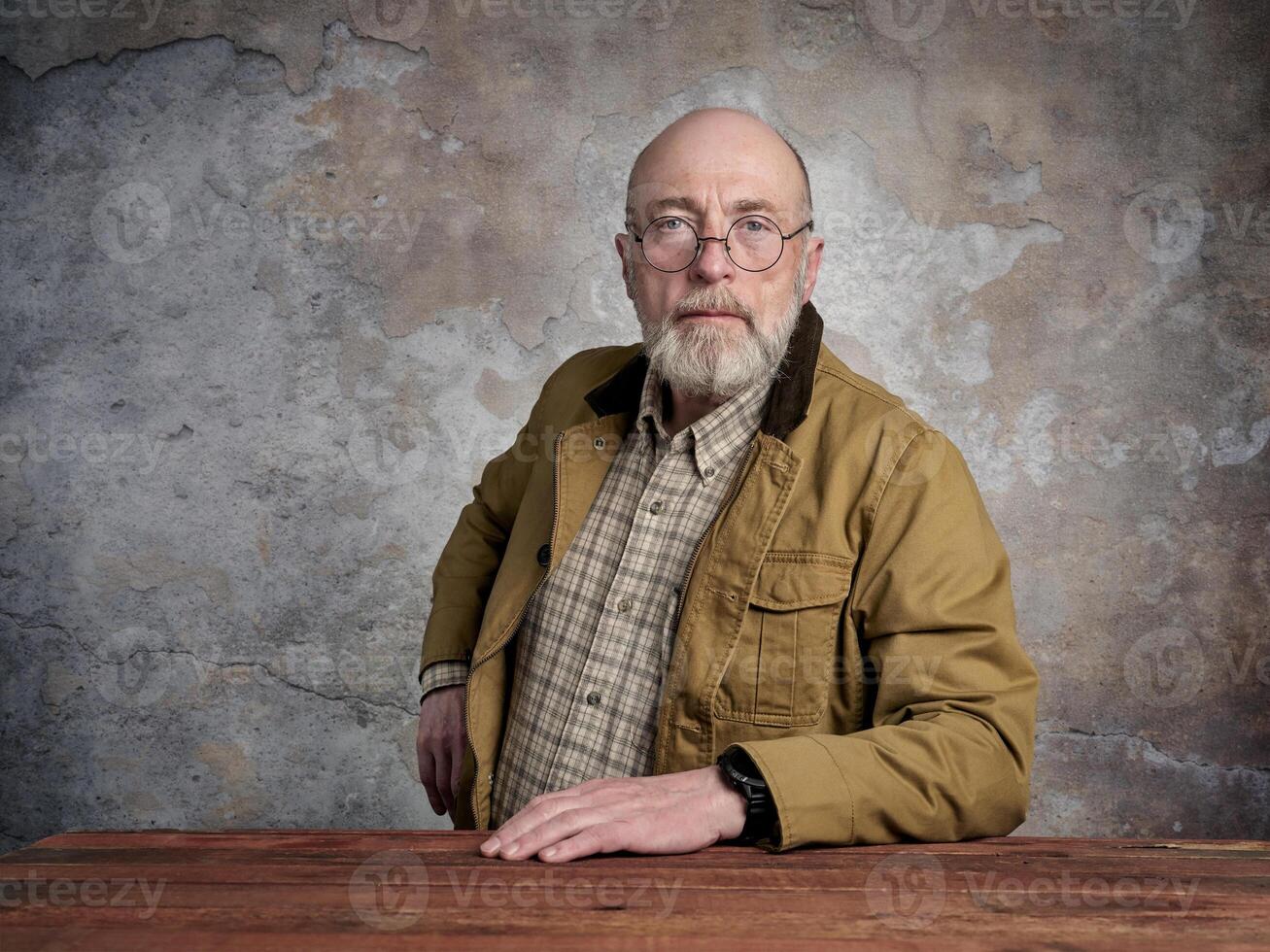 bearded senior man with glasses photo