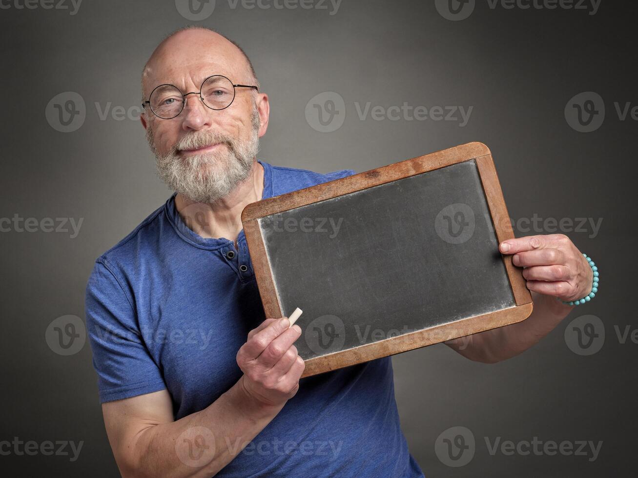 senior man with blank blackboard board photo