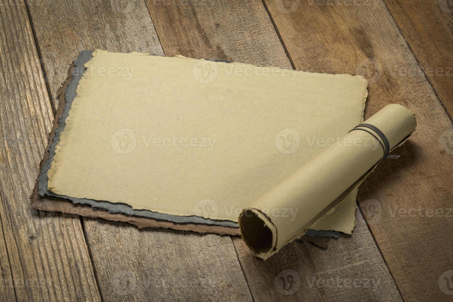 sheets of blank handmade paper with rough edges photo