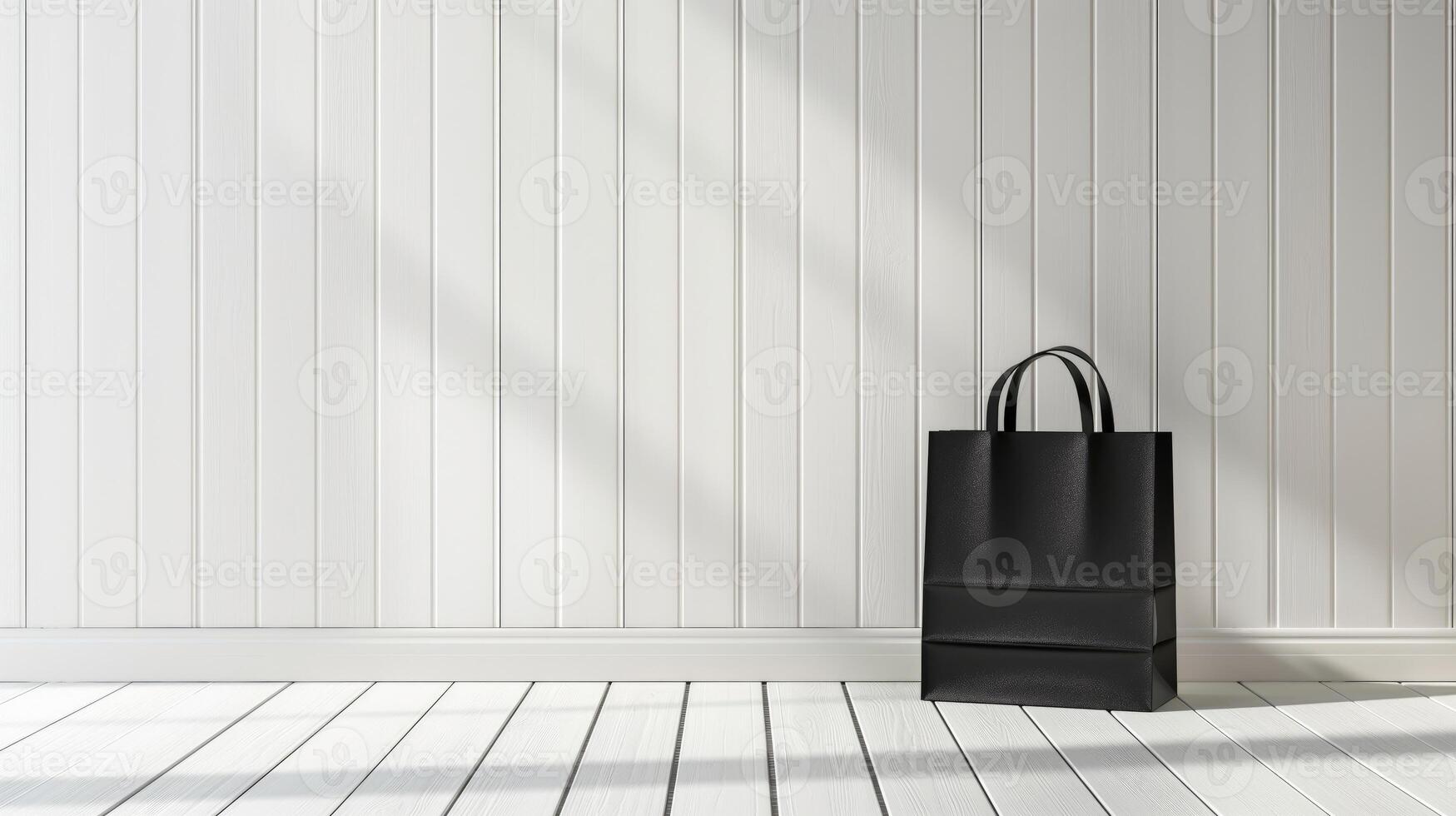 A black shopping bag is placed on a white wooden table in a room, mockup with copy space photo