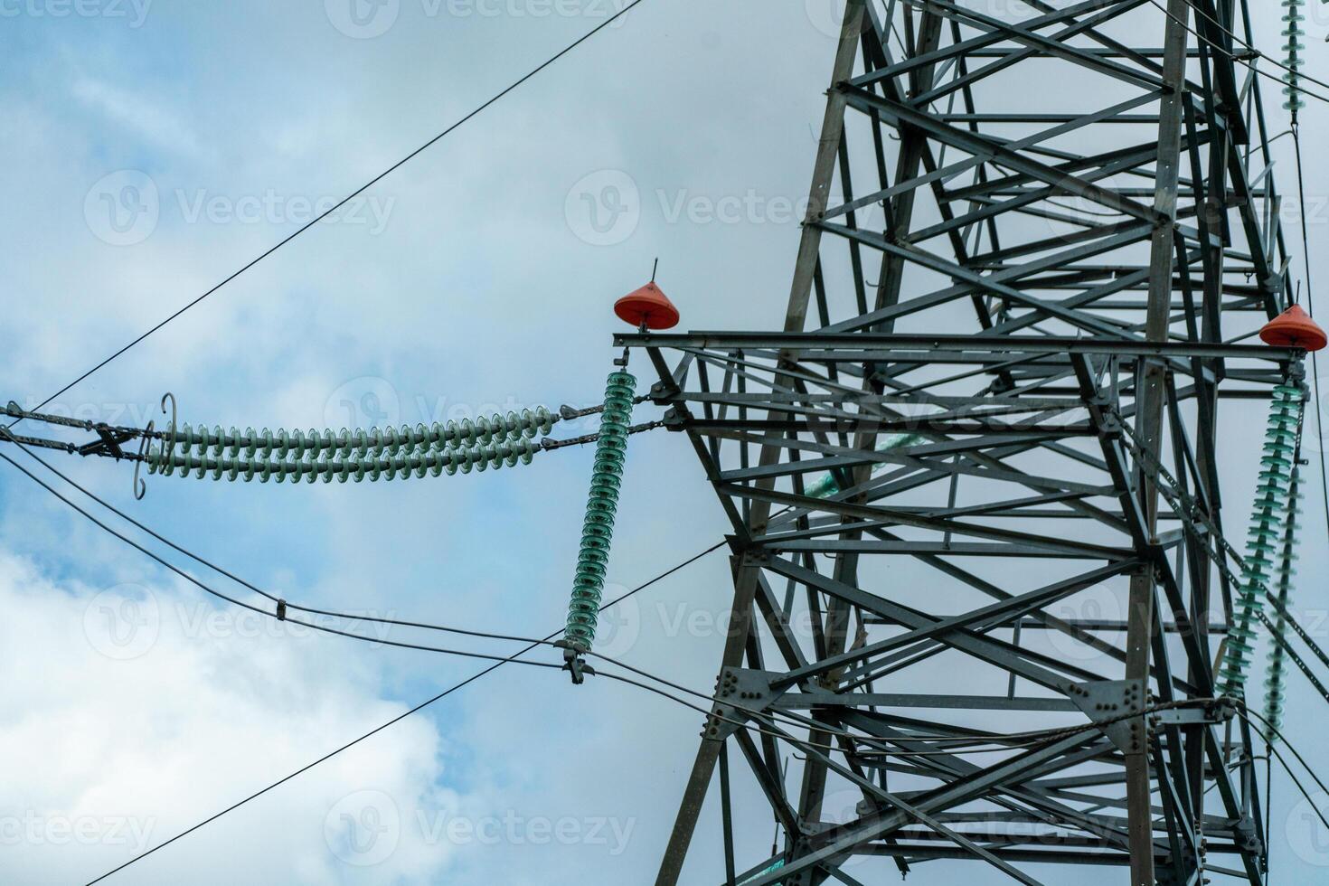 High voltage towers with sky background. Power line support with wires for electricity transmission. High voltage grid tower with wire cable at distribution station. Energy industry, energy saving photo