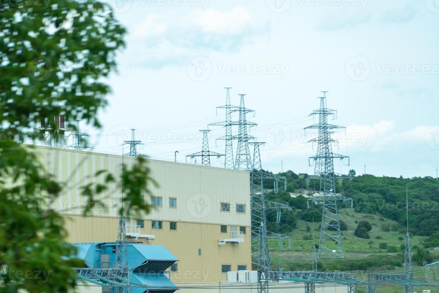 High voltage towers with sky background. Power line support with wires for electricity transmission. High voltage grid tower with wire cable at distribution station. Energy industry, energy saving photo