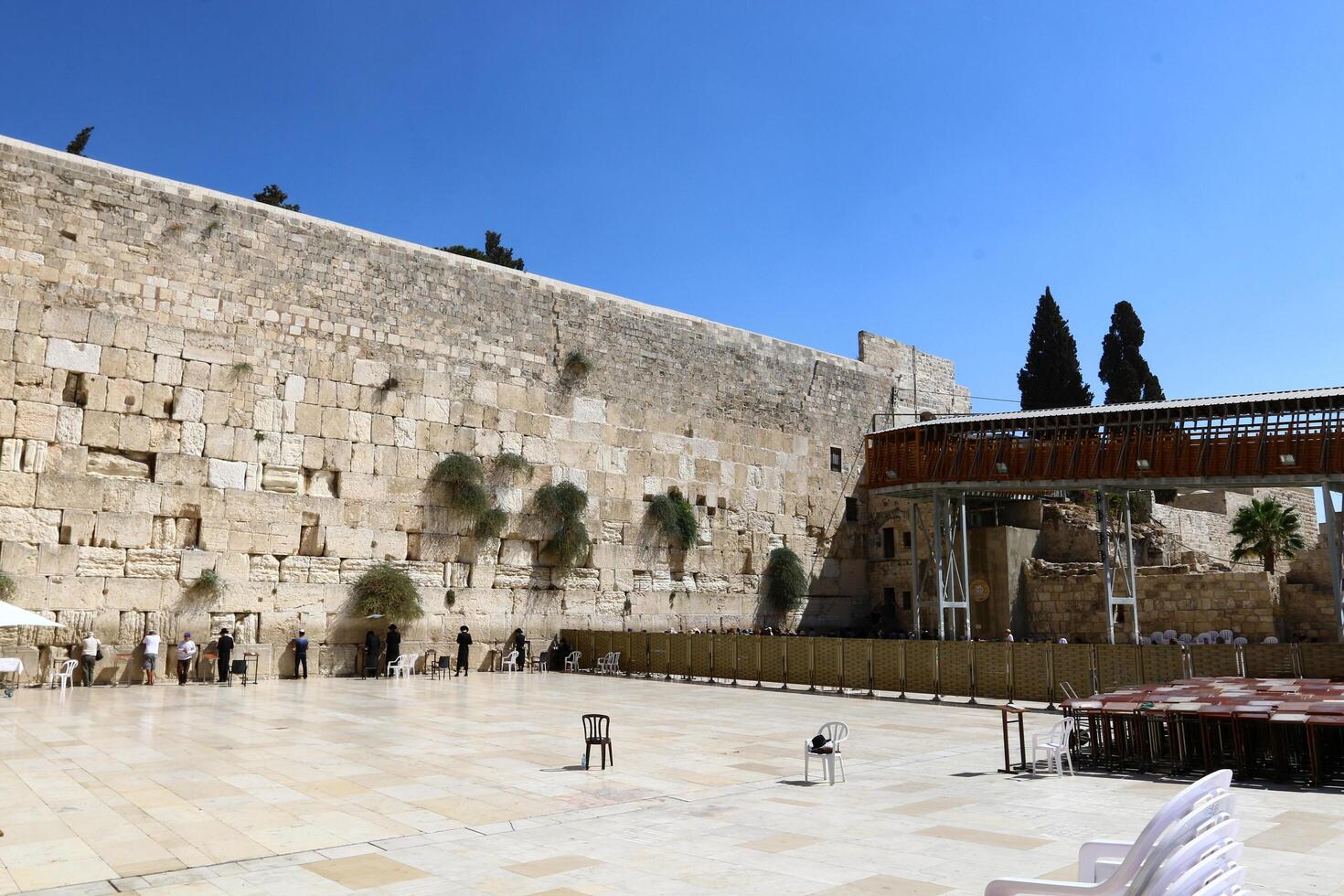 07 13 2023 Jerusalem Israel. The Western Wall is part of the ancient wall around the western slope of the Temple Mount in the Old City of Jerusalem. photo