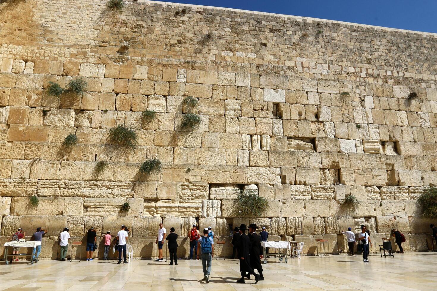 07 13 2023 Jerusalem Israel. The Western Wall is part of the ancient wall around the western slope of the Temple Mount in the Old City of Jerusalem. photo