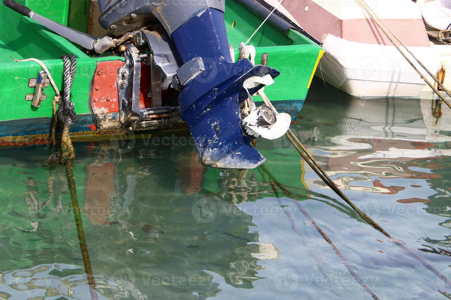 The propeller of a motor boat at the pier in the seaport. photo