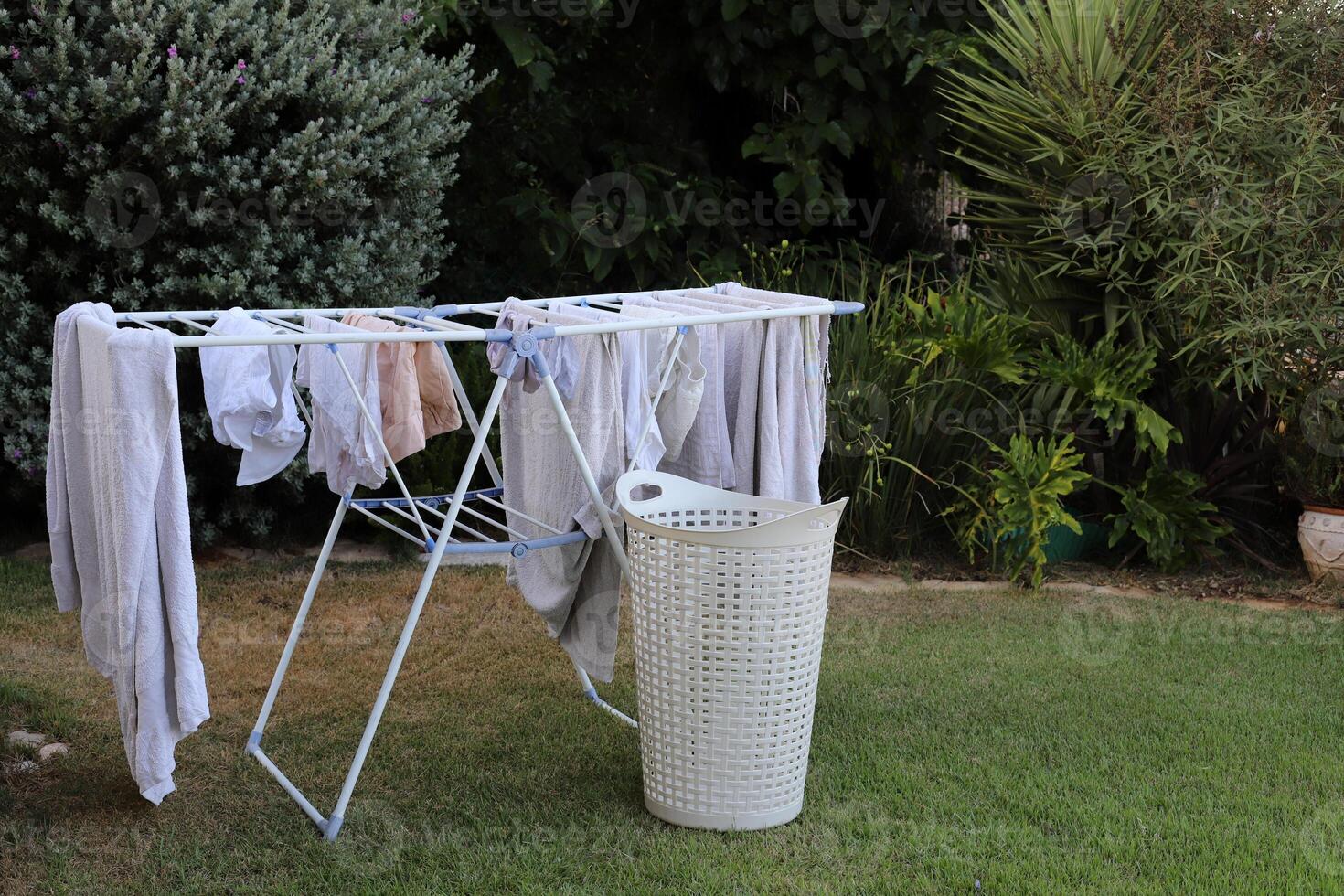 Washed laundry hangs on a rope outside the window. photo