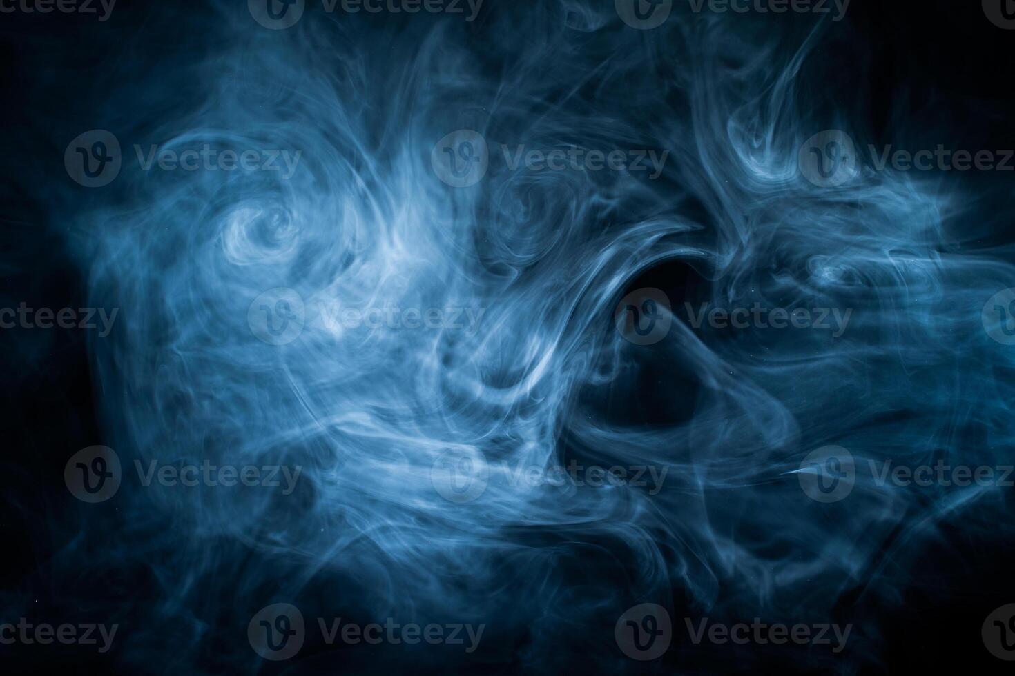 Blue fog haze on dark background. Abstract atmospheric smoke cloud. photo