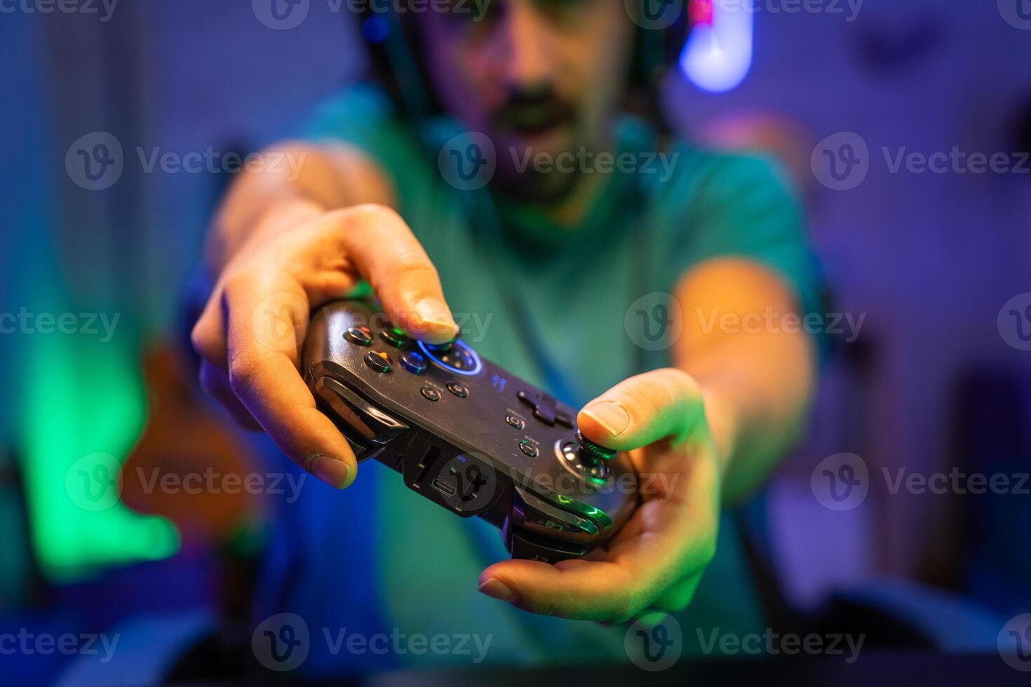 Modern gamer plays games with gamepad on a technological room entertainment, cyberspace. photo