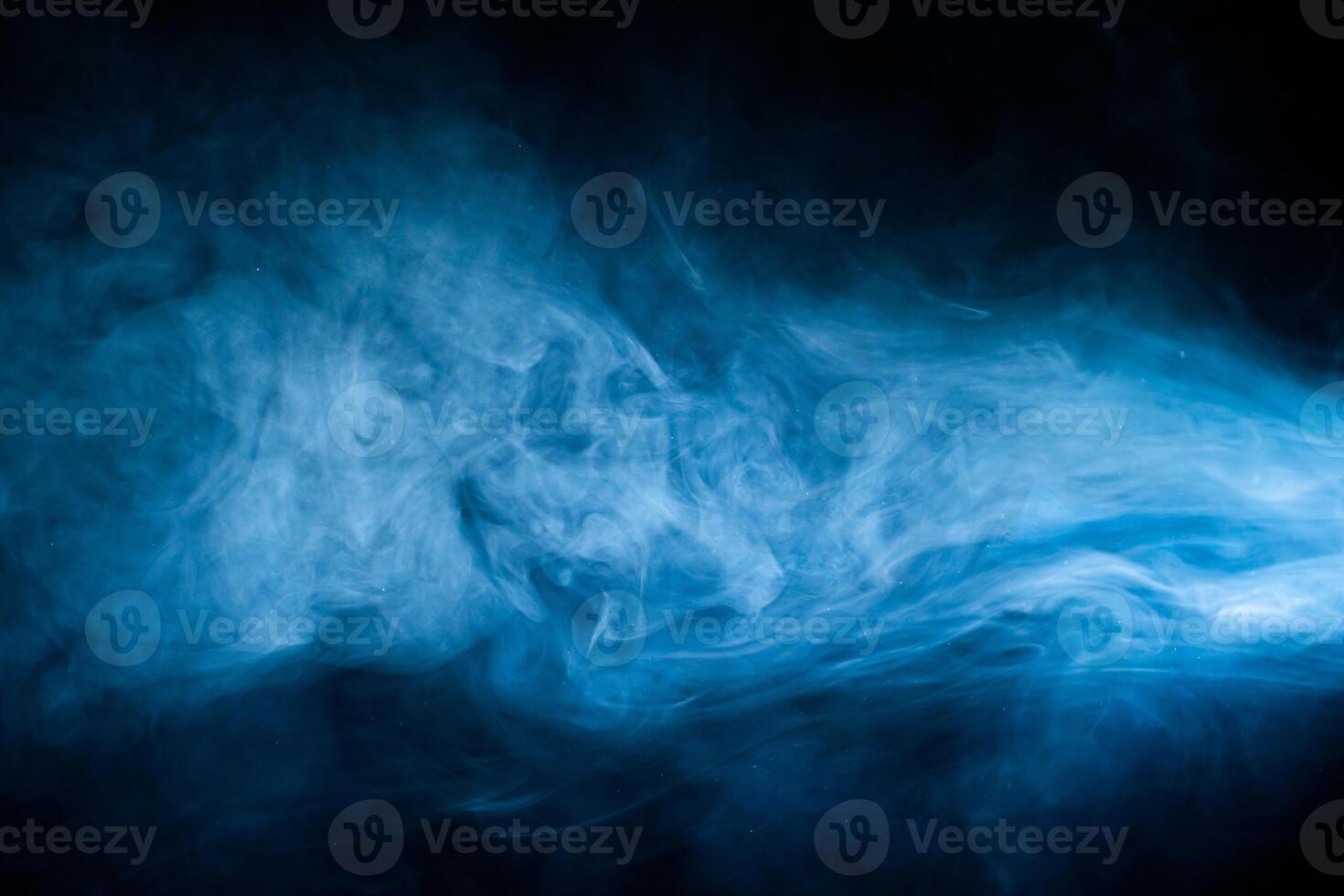Blue fog haze on dark background. Abstract atmospheric smoke cloud. photo