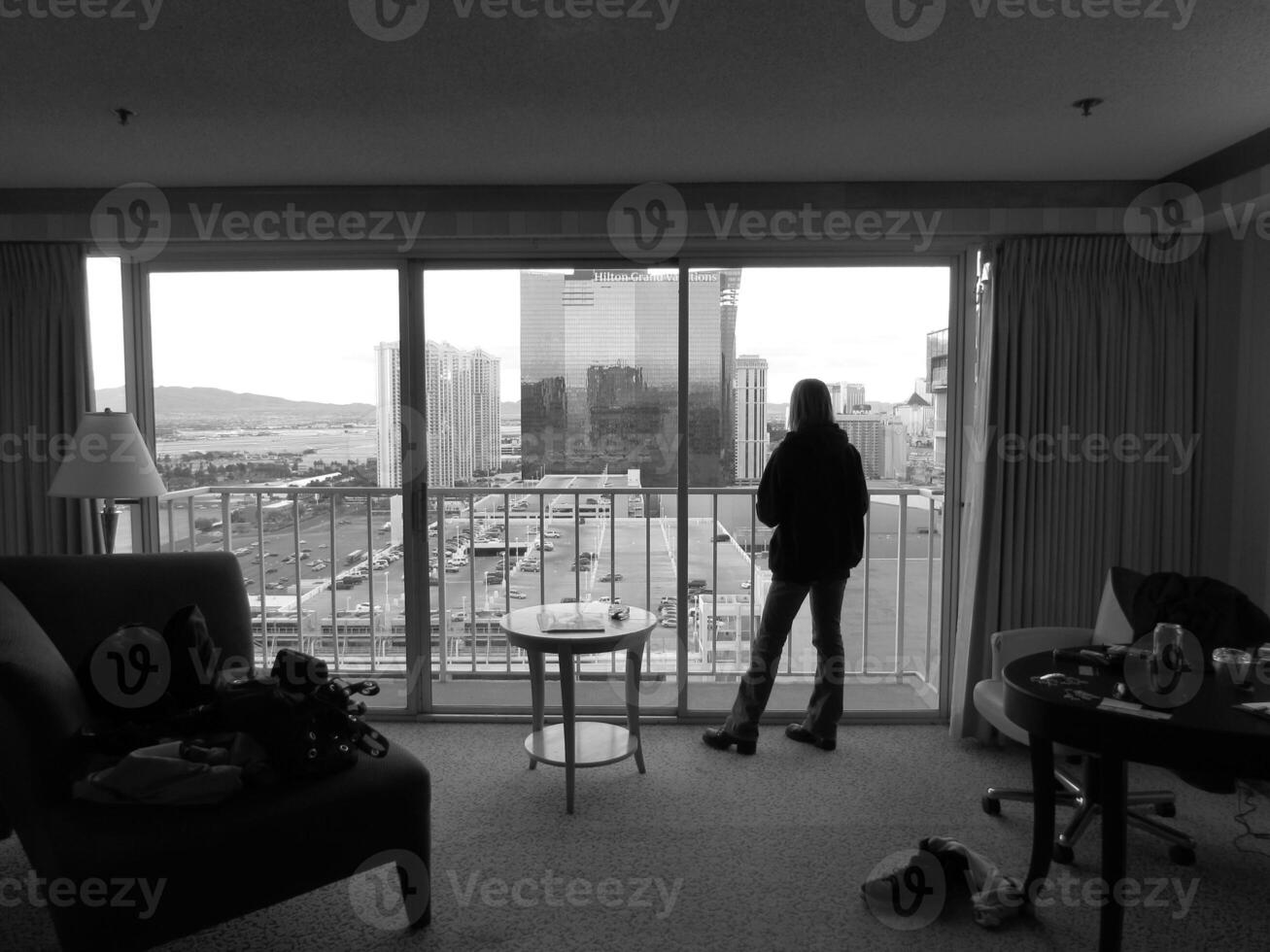 Woman Looking out Full Length Window in Las Vegas photo