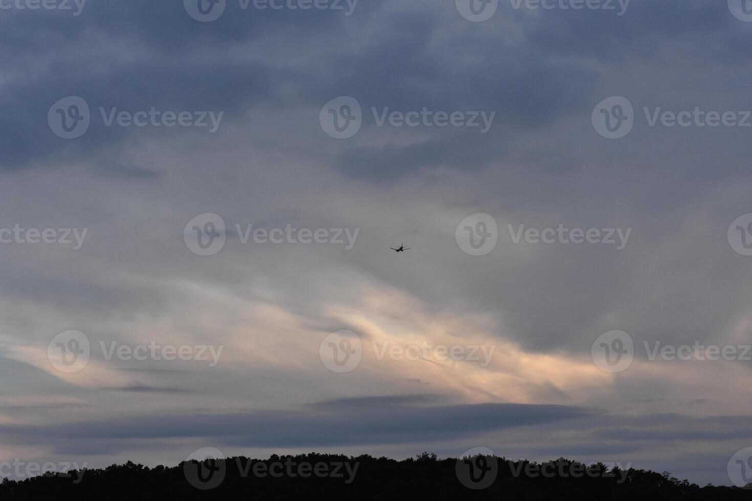 Clouds Building at Sunset in Bronx, New York, One Airplane in the Sky photo