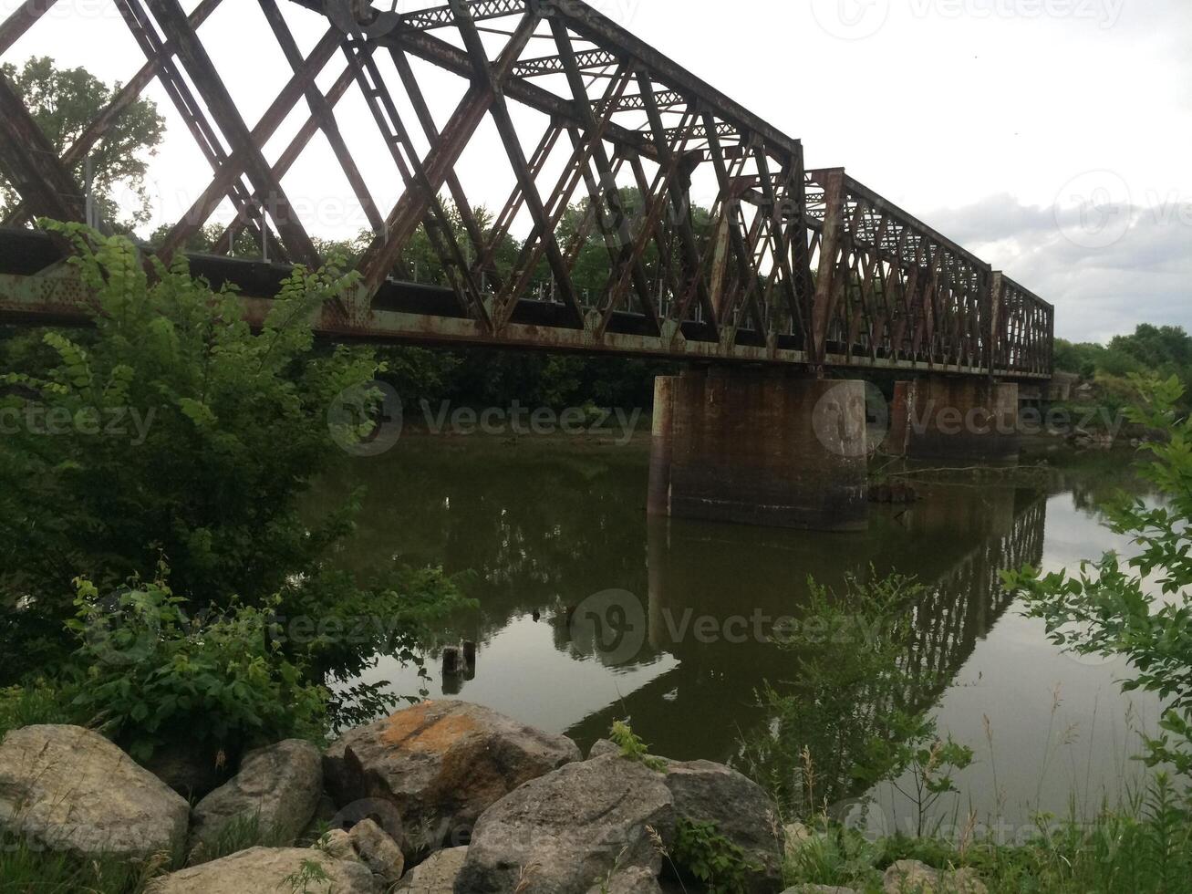 Manhattan Rail Bridge with River Reflection in Manhattan, Kansas photo