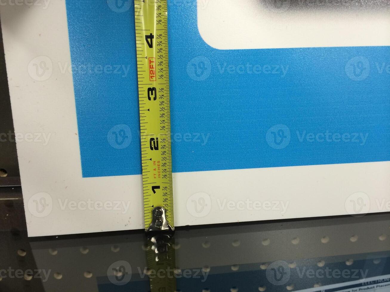 Measuring Tape Being Used on Retail Construction Project photo