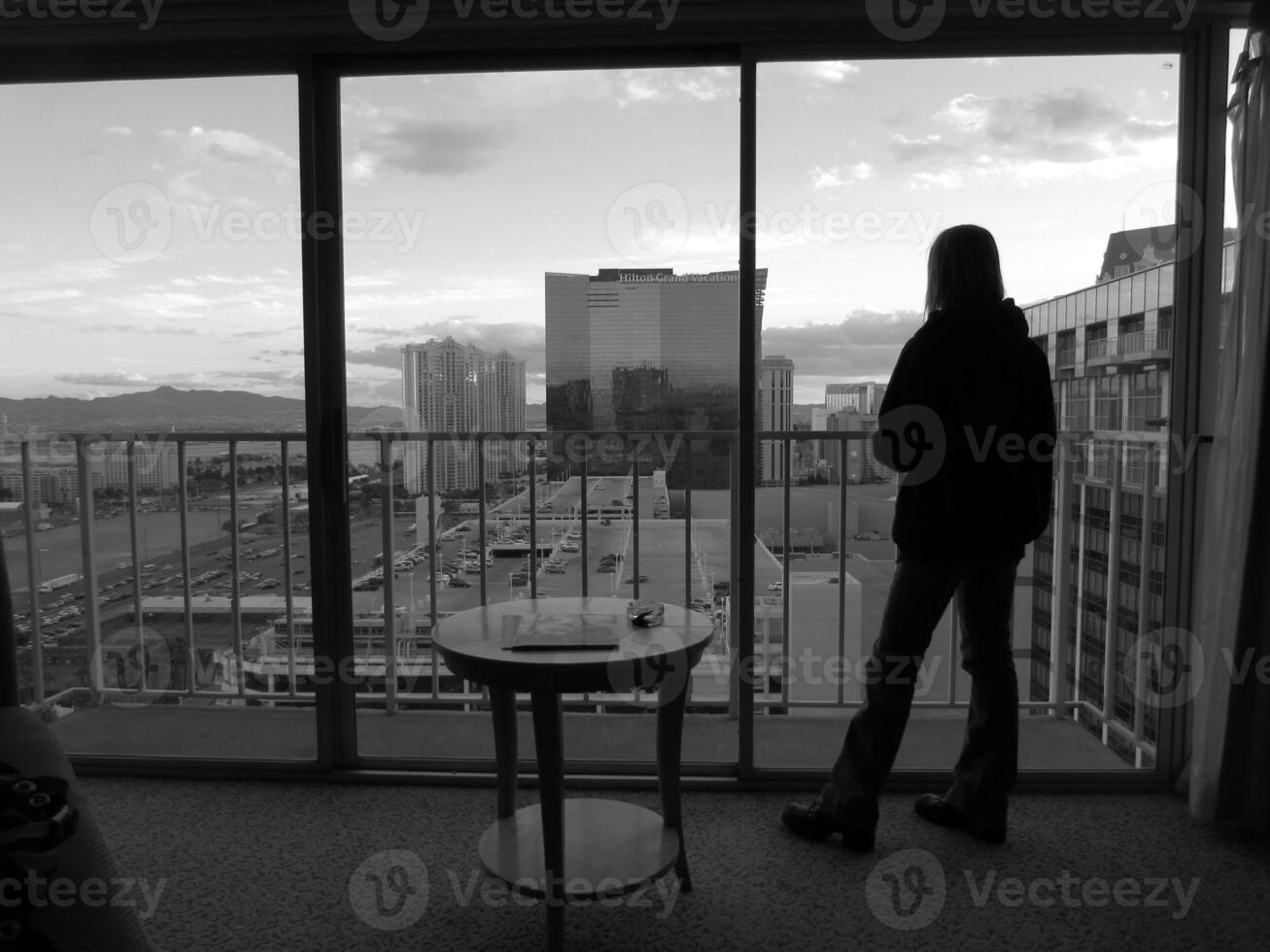 Woman Looking out Full Length Window in Las Vegas photo
