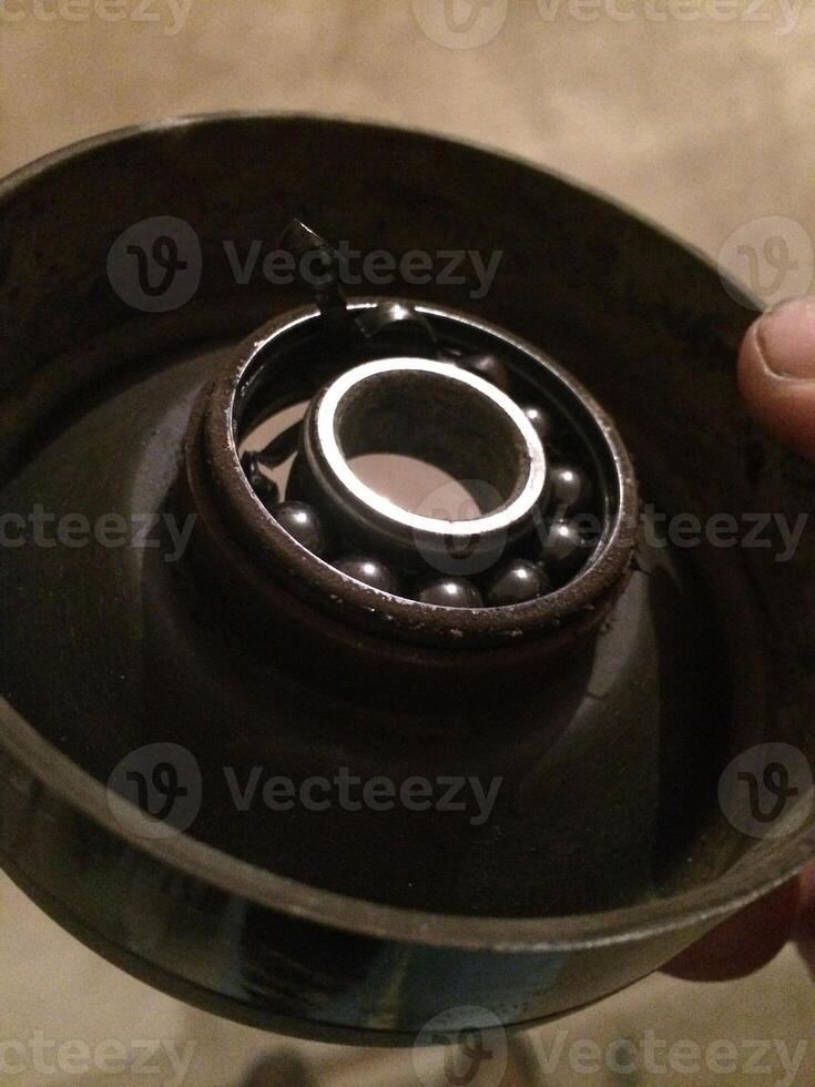 Broken Pulley For Car Belt, Missing Ball Bearings photo