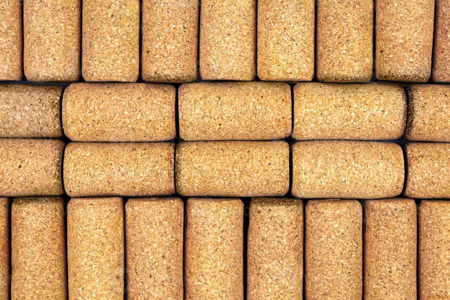 Background from textured wine corks, top view. place for text photo