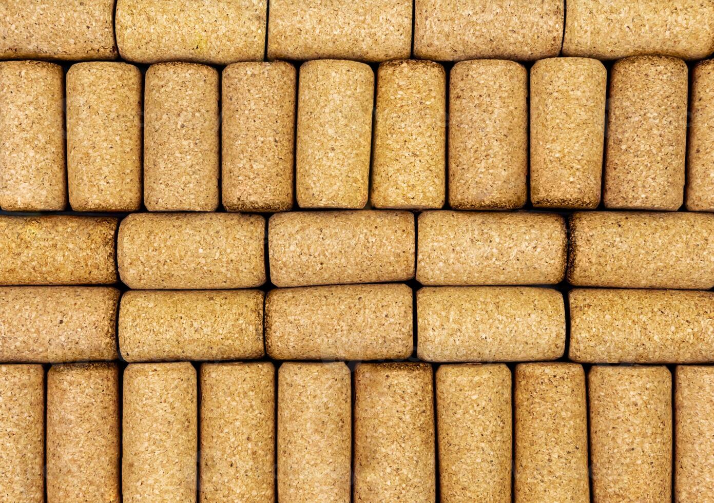 Background from textured wine corks, top view. place for text photo