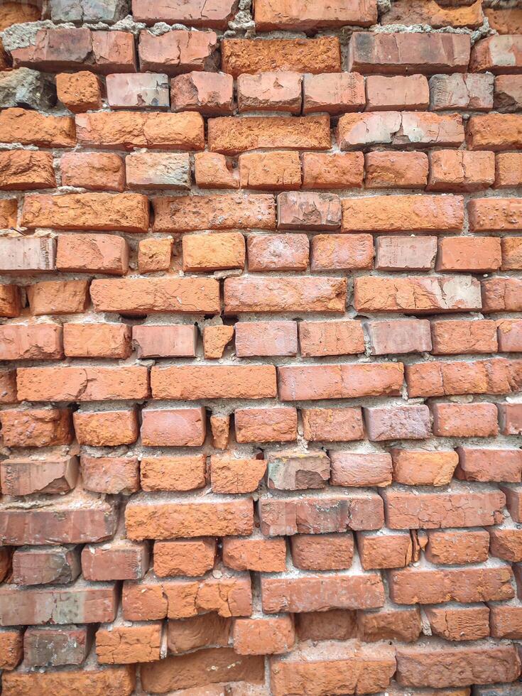 Background of wide old red brick wall texture. Home or office design backdrop photo