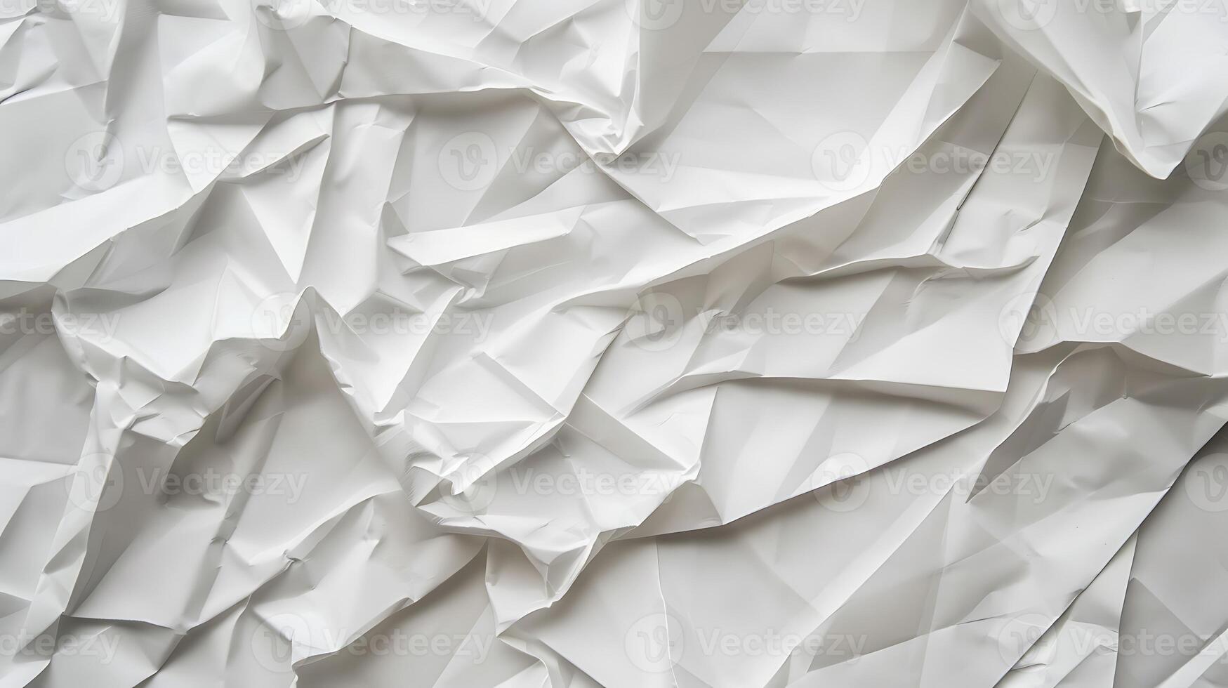 Abstract folded and crumpled white paper texture photo
