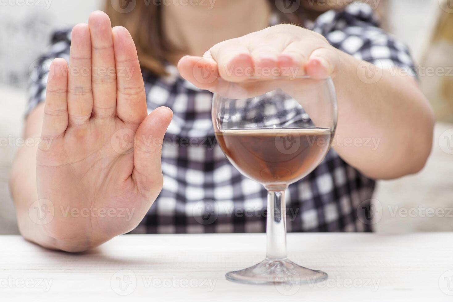 Young woman refused alcohol drink. Concept of alcoholism. Womans alcoholism photo